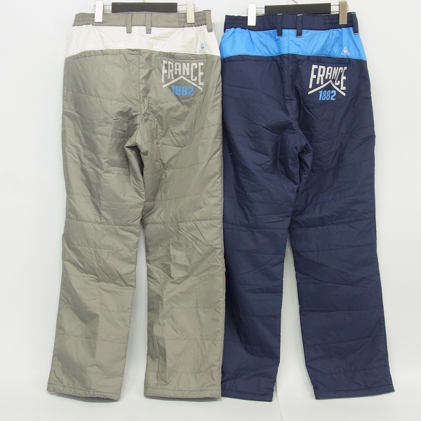 実際に弊社で買取させて頂いたle coq sportif/ルコック ゴルフウェア 中綿ナイロン パンツ 防寒 裾アジャスター ライトグレー/ネイビー L 2点セットの画像 1枚目