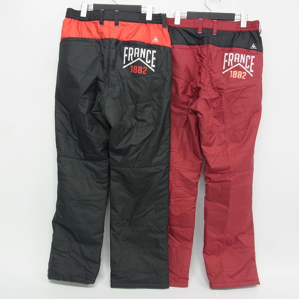 実際に弊社で買取させて頂いたle coq sportif/ルコック ゴルフウェア 中綿ナイロン パンツ 防寒 裾アジャスター ブラック/レッド L 2点セットの画像 1枚目