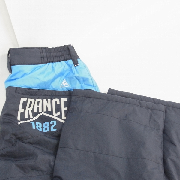 実際に弊社で買取させて頂いたle coq sportif/ルコック ゴルフウェア 中綿ナイロン パンツ 防寒 裾アジャスター ライトグレー/ネイビー L 2点セットの画像 5枚目