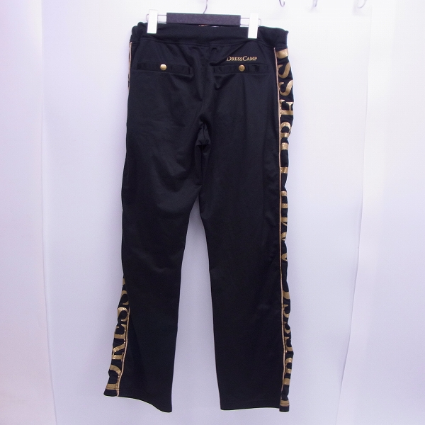 実際に弊社で買取させて頂いたDRESSCAMP/ドレスキャンプ サイドロゴ/金ラメ /スタッズ トラックパンツ Mの画像 1枚目