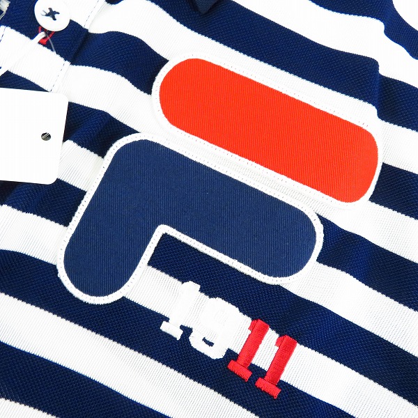 実際に弊社で買取させて頂いた【未使用】FILA/フィラ ゴルフ ワッペン&刺しゅう付き 半袖ボーダーポロシャツ 速乾・UVカット LLの画像 6枚目