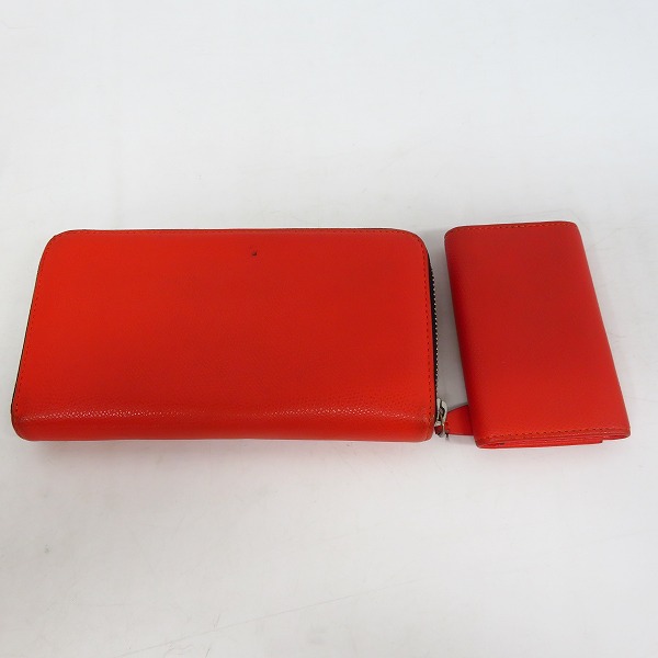 実際に弊社で買取させて頂いたEMPORIO ARMANI/エンポリオアルマーニ レザー 6連キーケース/ラウンドジップ長財布 オレンジ 2点セット の画像 1枚目