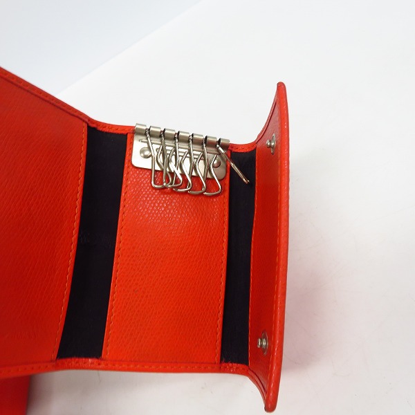 実際に弊社で買取させて頂いたEMPORIO ARMANI/エンポリオアルマーニ レザー 6連キーケース/ラウンドジップ長財布 オレンジ 2点セット の画像 4枚目