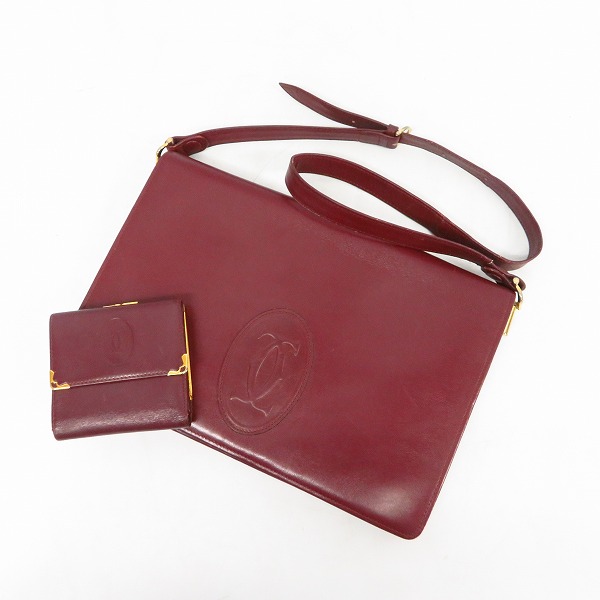 実際に弊社で買取させて頂いたCartier/カルティエ ロゴ マストライン レザー ショルダーバッグ ボルドー/レザー がま口三つ折り財布 ボルドー 2点セット