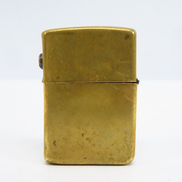 実際に弊社で買取させて頂いたTRAVIS WALKER/トラヴィスワーカー ZIPPO/ジッポー ブラス フレイムスカル/サイドロゴ メタル貼り 2008年製の画像 1枚目