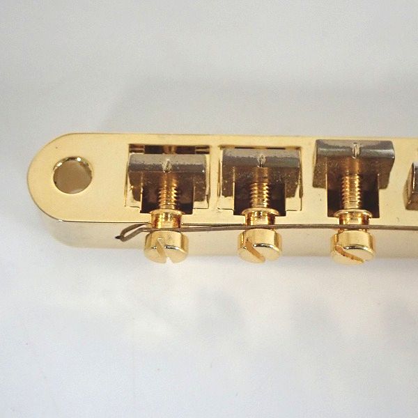 実際に弊社で買取させて頂いたEpiphone/エピフォン Korina Flying-V搭載ブリッジ B-2 ゴールドパーツの画像 1枚目