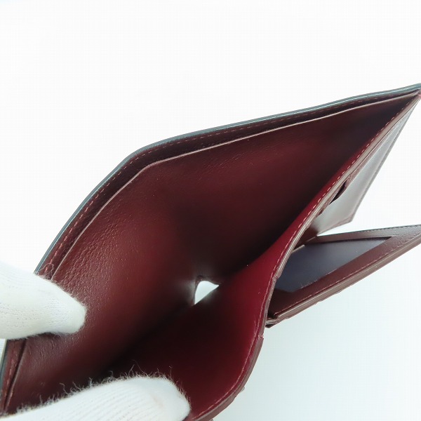 実際に弊社で買取させて頂いたCartier/カルティエ レザー 二つ折り財布 ブラックの画像 5枚目