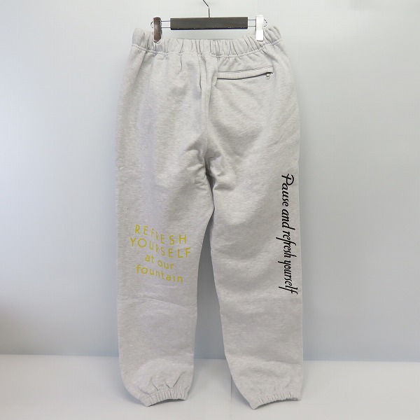 実際に弊社で買取させて頂いた【未使用】ATMOS × COCA-COLA/アトモス×コカ コーラ DRINK DELICIOUS スウェットパンツ AT20-052/Lの画像 1枚目