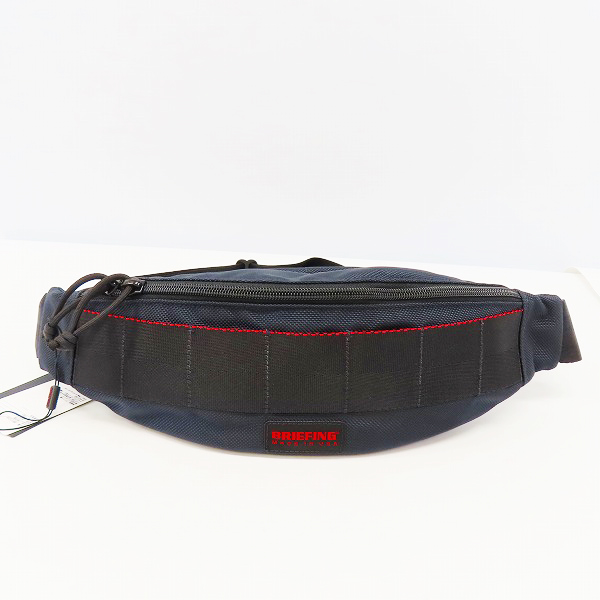 実際に弊社で買取させて頂いたBRIEFING/ブリーフィング TRIPOD トライポッド ボディバッグ ディープシー BRF071219