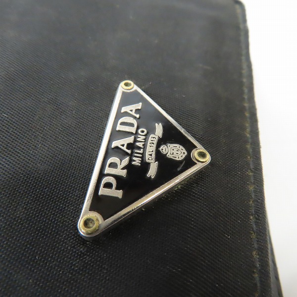 実際に弊社で買取させて頂いた【難あり】PRADA/プラダ サフィアーノ レザー 二つ折りコンパクトウォレット/財布の画像 5枚目