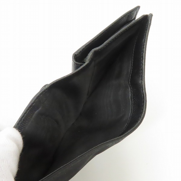 実際に弊社で買取させて頂いた【難あり】PRADA/プラダ サフィアーノ レザー 二つ折りコンパクトウォレット/財布の画像 3枚目