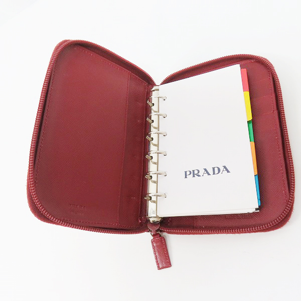 実際に弊社で買取させて頂いたPRADA/プラダ サフィアーノレザー ラウンドファスナー 手帳カバーの画像 3枚目