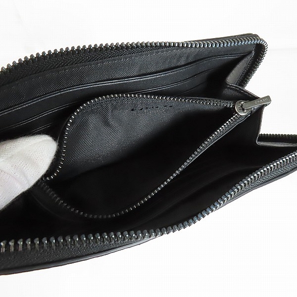 実際に弊社で買取させて頂いたCOACH/コーチ カモ柄 ラウンドジップウォレットの画像 3枚目