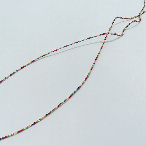 実際に弊社で買取させて頂いたUNDERCOVERISM/アンダーカバーイズム FFシルクネックレス O4N01 の画像 3枚目