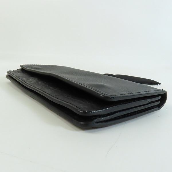 実際に弊社で買取させて頂いたCALEE/キャリー レザーストラップ付き 2つ折り財布の画像 2枚目