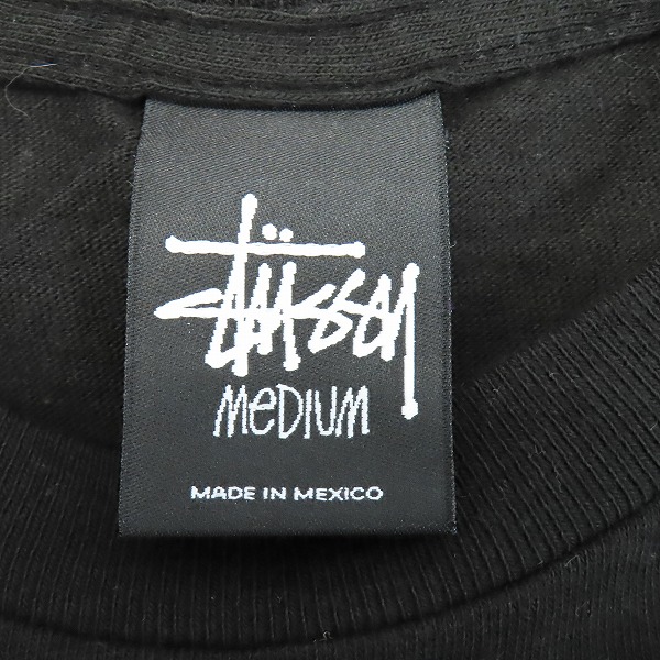 実際に弊社で買取させて頂いた STUSSY/ステューシー GLOBAL ROOTS プリントTシャツ 半袖カットソー ブラック Mの画像 2枚目