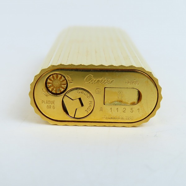 実際に弊社で買取させて頂いたCartier/カルティエ ガスライター ラウンド ゴールドカラー ストーン付きの画像 4枚目