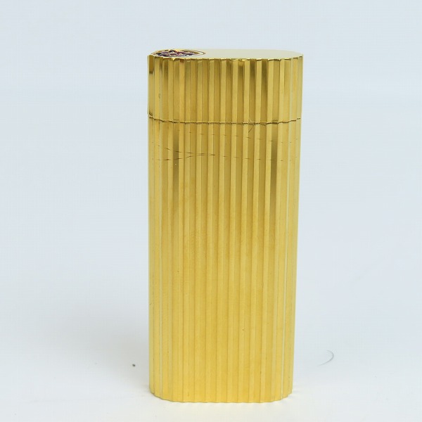 実際に弊社で買取させて頂いたCartier/カルティエ ガスライター ラウンド ゴールドカラー ストーン付きの画像 1枚目