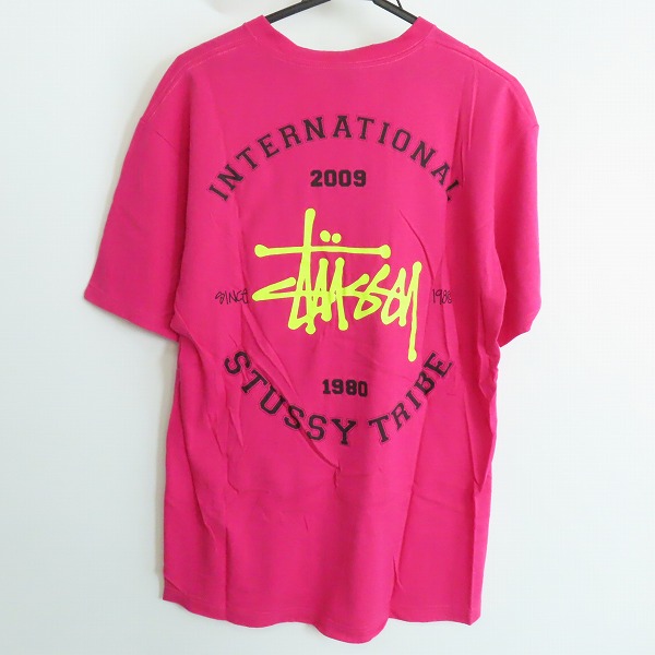 実際に弊社で買取させて頂いたSTUSSY/ステューシー INTERNATIONAL STUSSY TRIBE バックプリント Ｔシャツ ピンク/Ｌの画像 1枚目