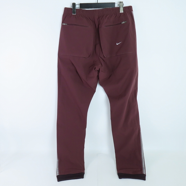 実際に弊社で買取させて頂いたNIKE × UNDERCOVER/ナイキ×アンダーカバー Gyakusou Team/ギャクソウ  ナイロントラックパンツ 842794-210/Lの画像 1枚目