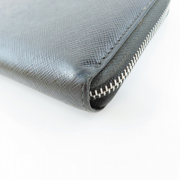 実際に弊社で買取させて頂いたPRADA/プラダ サフィアーノレザー ロゴ ラウンドジップ長財布の画像 7枚目