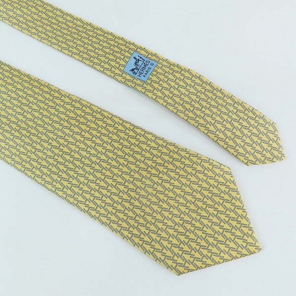 実際に弊社で買取させて頂いたHERMES/エルメス 総柄 イエロー シルク  ネクタイの画像 1枚目