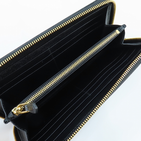 実際に弊社で買取させて頂いたPRADA/プラダ TRIANGOLO PORTAFOGLIO SAFFIANO/サフィアーノレザー トライアングルロゴ ラウンドジップ 長財布 1ML506 QHHの画像 3枚目