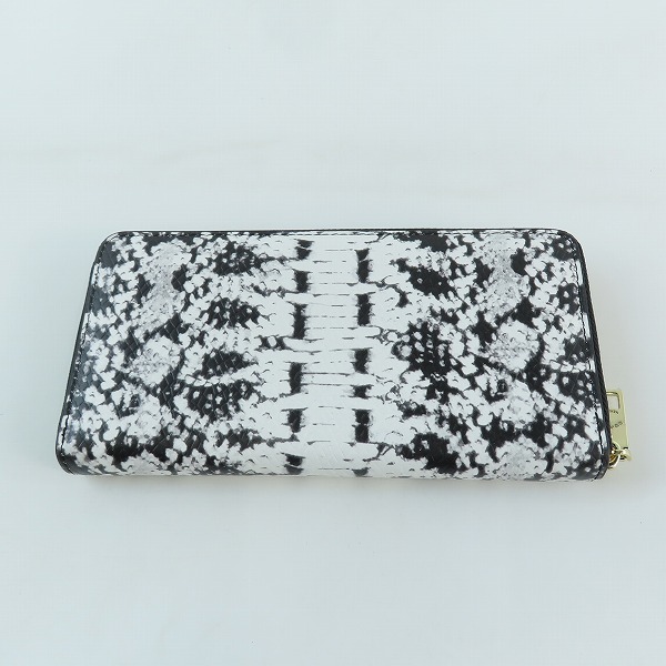 実際に弊社で買取させて頂いたCOACH/コーチ 蛇柄 ラウンドジップ 長財布の画像 1枚目