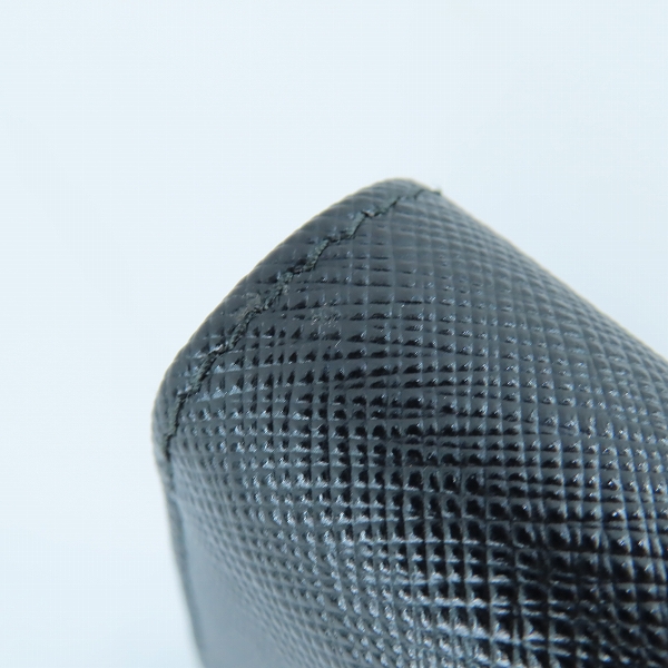 実際に弊社で買取させて頂いたPRADA/プラダ TRIANGOLO PORTAFOGLIO SAFFIANO/サフィアーノレザー トライアングルロゴ ラウンドジップ 長財布 1ML506 QHHの画像 7枚目