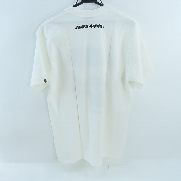 実際に弊社で買取させて頂いたA BATHING APE×KAWS/アベイジングエイプ×カウズ  初期タグ プリント Tシャツ /Mの画像 1枚目
