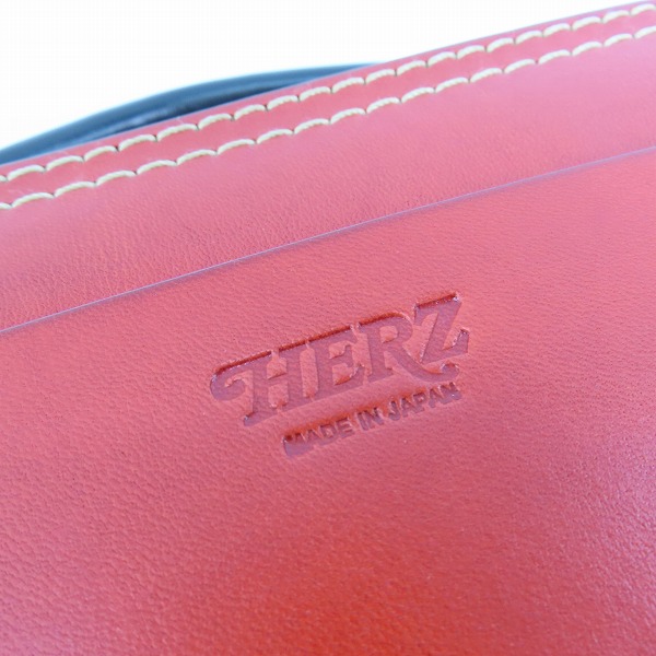 実際に弊社で買取させて頂いたHERZ/ヘルツ ラウンドファスナー 2way レザー ハンドバッグ/ショルダーバッグ レッド×ブラックの画像 4枚目