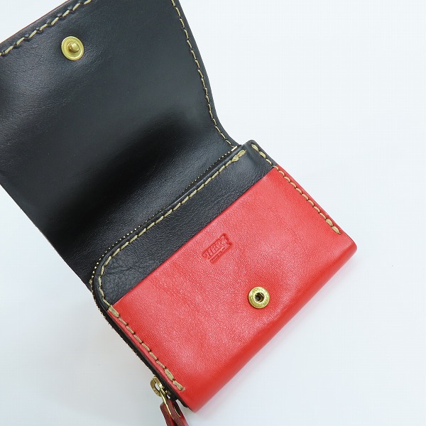 実際に弊社で買取させて頂いたHERZ/ヘルツ レザー 二つ折り財布 レッドの画像 3枚目