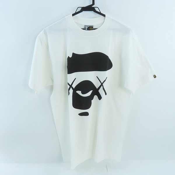 実際に弊社で買取させて頂いたA BATHING APE×KAWS/アベイジングエイプ×カウズ  初期タグ プリント Tシャツ /M