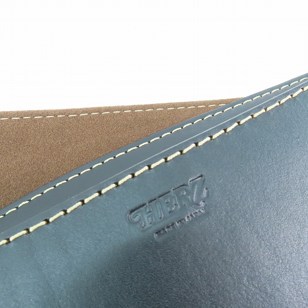 実際に弊社で買取させて頂いたHERZ/ヘルツ 50周年/50th記念 レザー ウエストバッグ ブラック×レッドの画像 4枚目