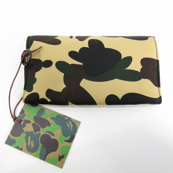 実際に弊社で買取させて頂いた【未使用】A BATHING APE ×PORTER/アベイシングエイプ×ポーター 1ST CAMO LONG WALLET ロングウォレット 001GDG831972Xの画像 1枚目