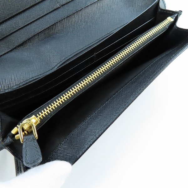 実際に弊社で買取させて頂いたPRADA/プラダ リボン サフィアーノレザー二つ折り長財布 1M1132の画像 4枚目