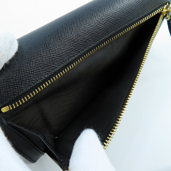 実際に弊社で買取させて頂いたPRADA/プラダ リボン サフィアーノレザー二つ折り長財布 1M1132の画像 6枚目