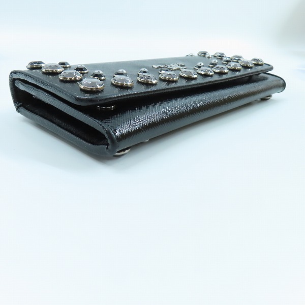 実際に弊社で買取させて頂いたPRADA/プラダ  スタッズ 二つ折り ロング ウォレット 1M1132の画像 2枚目