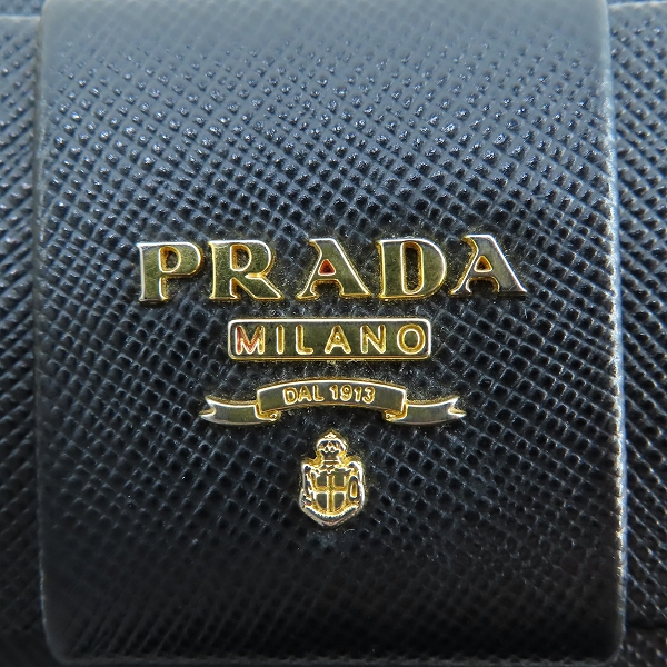 実際に弊社で買取させて頂いたPRADA/プラダ リボン サフィアーノレザー二つ折り長財布 1M1132の画像 8枚目