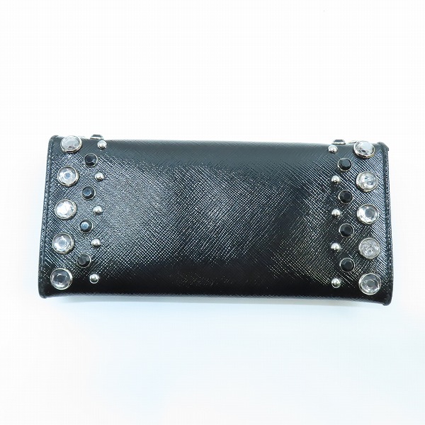 実際に弊社で買取させて頂いたPRADA/プラダ  スタッズ 二つ折り ロング ウォレット 1M1132の画像 1枚目
