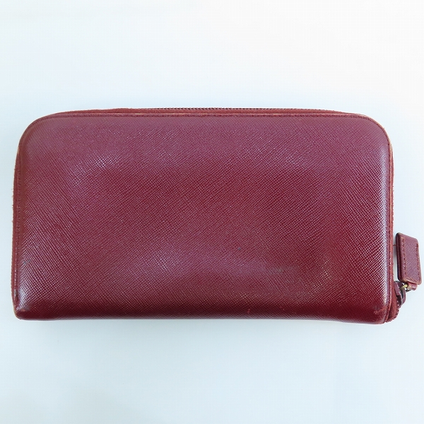 実際に弊社で買取させて頂いたPRADA/プラダ 三角ロゴプレート ラウンドジップ長財布 の画像 1枚目