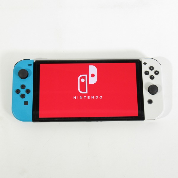 実際に弊社で買取させて頂いた任天堂 Nintendo Switch/ニンテンドースイッチ 有機ELモデル 本体 HEG-001/カービィ フロントカバー/クイックポーチ付きの画像 1枚目
